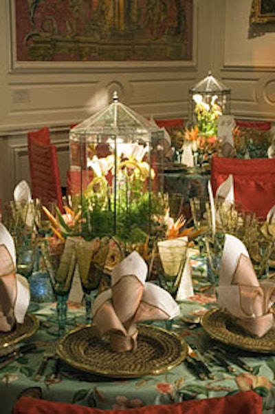 Jack Lucky Designs topped each table in theLittle Mantle room with ladyslipper orchids in a miniature greenhouse.