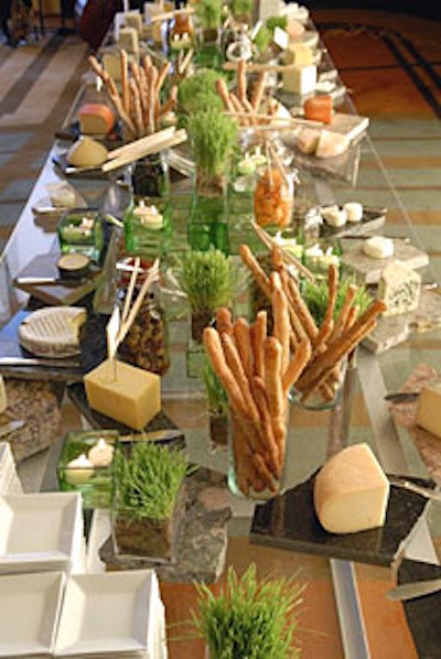 The event’s cheese buffet took on a naturallook, thanks to the live grass accents and the stone cutting boards.