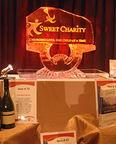 An ice sculpture served as the backdrop for a silent-auction table. With all the decor, lighting, and food as well as the event space donated by the vendors, every dollar raised went directly to Heart of America.