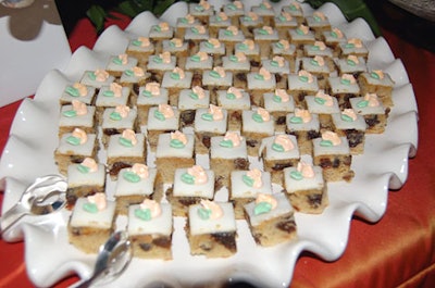 Tiny petit fours were part of a multitude of treats offered at the dessert table. Besides sweets, guests could munch on fresh fruit, salted nuts, and pungent cheeses.