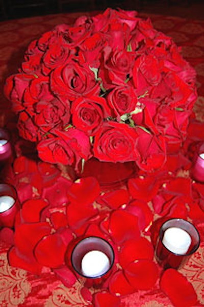 Flowers were kept to a minimum at the after party, with small arrangements of red roses and petals adorning the dessert tables.