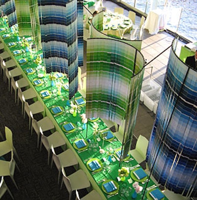 The swatches hung above long tables in the center of the dinner area. Inspired by the colors used in the museum’s graphic materials, Stark collected blue and green paint strips from hardware stores.