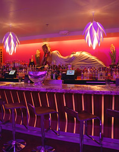 A 10-foot-long female Buddha graces the bar in Lotus's cellular room.