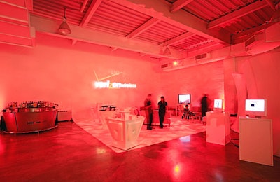 A glowing red lounge on the lower level was where Verizon Wirelessmarketed its camera phones, with several models lined up on low-lyingcocktail tables, encouraging guests to snap pictures of themselves (which were beamed upstairs to a screen overlooking the dance floor).