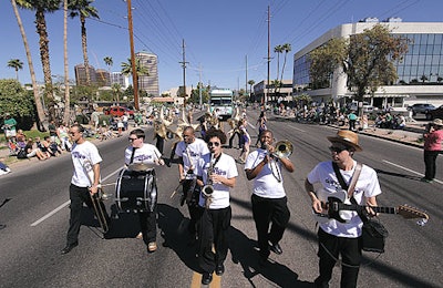 Band members paraded through Phoenix on March 17. They performed with marching-band-type instruments when on foot.