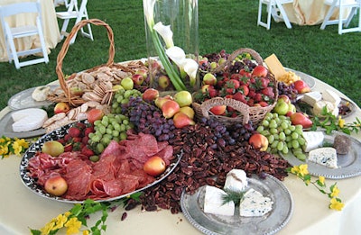 Baskets overflowed with strawberries, nuts, and runny cheeses.