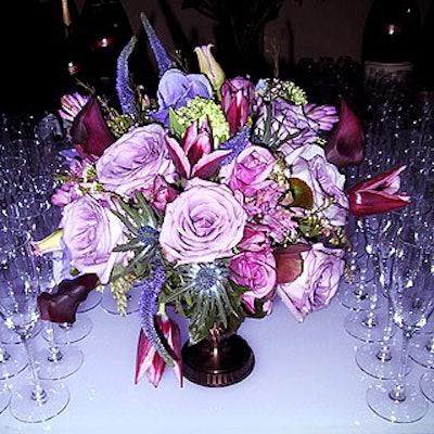 Arturo Quintero of Prudence Designs created small purple bouquets to decorate the bars, and two gigantic arrangements set in the center of the two cocktail areas.