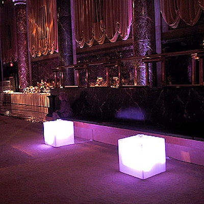 Smaller Lucite cubes underlit by purple lights served as cocktail tables for lounging guests.