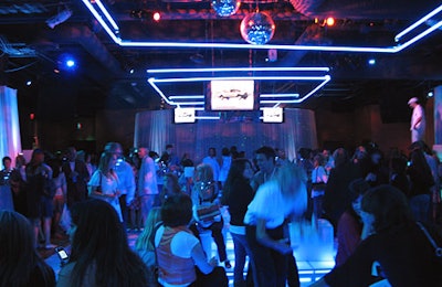 A dance room featured white decor and blue lighting.