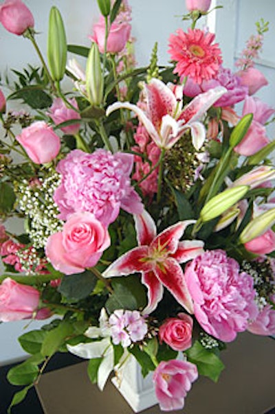 The embassy provided flowers including large pink roses, lilies, peonies, and gerbera daisies.