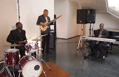 A jazz trio set an upbeat, contemporary tone for the fund-raiser.