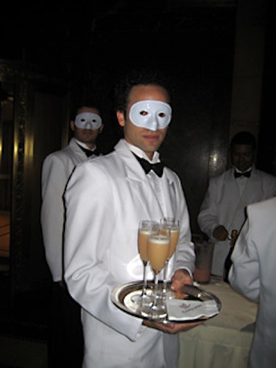 The mask theme extended to waiters and bartenders, who served mojitos and Cipriani's signature bellinis during the cocktail hour.