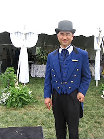 A uniform-clad doorman welcomed visitors to the Ritz-Carlton tent, which featured dark wooden patio furniture and oversized canvas umbrellas atop sod the hotel had laid out on the tent floor (a decor note that set the tent apart from the gravel floors in the other tents).
