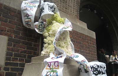 An arrangement of flowers and ribbons flanked the entrance to the Armory.