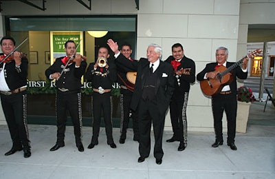 The man of honor waved to the crowd in front of a gaggle of mariachis.