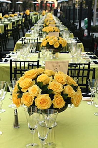 Hundreds of yellow roses topped cocktail and dinner tables.