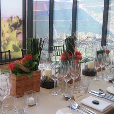 River rocks filled the base of candleholders and topped individual place settings.