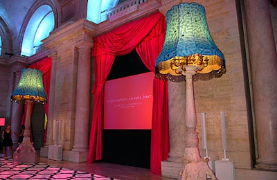 In Astor Hall, red curtains contrasted with turquoise lamp shades.
