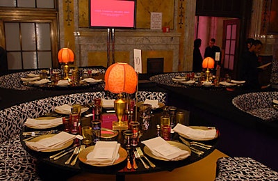 The dining area held a mix of banquettes and traditional chairs. Instead of floral arrangements and tablecloths, gold-colored flatware and tinted glasses decorated each table.