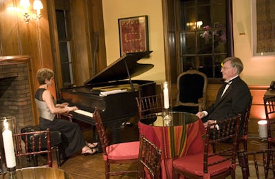 Bar tables with Peruvian tablecloths and mirrored tabletops accented Myriam Avalos's performance in the drawing room.