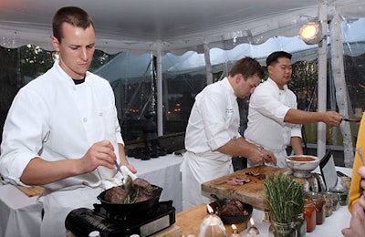 QualityMeats served filet mignon with QM steak sauce. When asked about keepingup with demand as the crowd thickened, the restaurant's Andrew Wardsaid, 'The busier we get, the better we'll be,' noting the lack of timefor samples to cool off.