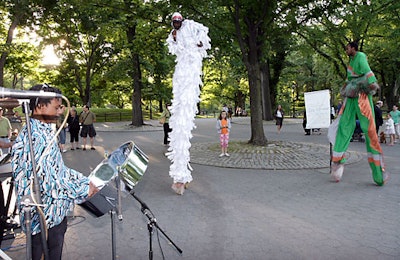A steel drum band, stiltwalkers (like those seen at festivals and fairs in Barbados), and dancers performed at the entrance to the Taste of Summer tent.