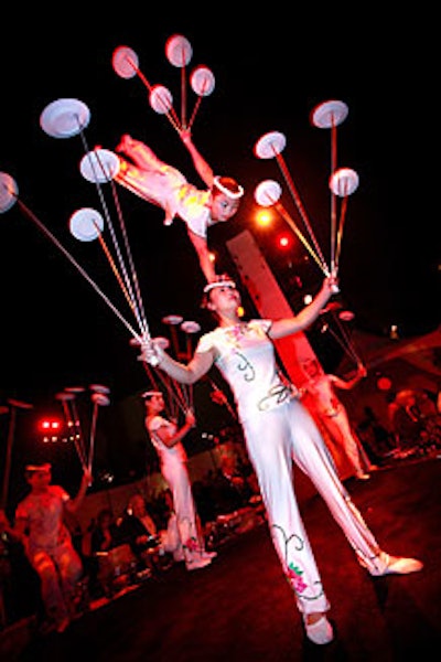 The acrobats' plate-juggling feats entertained the crowd of 1,200.