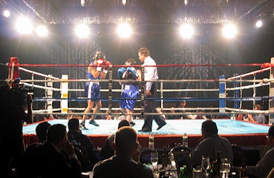 A ring from J.K. Ringside was set up in the middle of the Sheraton's ballroom an hour before dinner began. The lighting designers used gobos projecting the American flag and fireworks to create a patriotic feel.