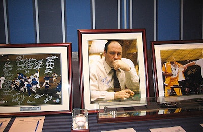 With items including signed baseballs, helmets, and jerseys as well as photographs like this one of Tony Soprano at a poker table, the silent auction was perfectly suited to the very masculine crowd.