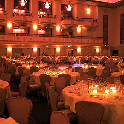 The Waldorf=Astoria's Grand Ballroom was illuminated with soft candlelight and decorated with simple flower arrangements by Floralia.
