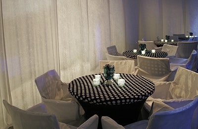 Billowing curtains covered up the windows and entrances to the stores in Rockefeller Center's underground concourse and helped showcase the white-on-black polka-dotted tables.