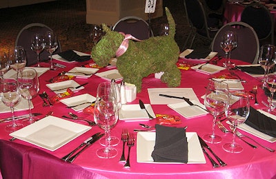 Florida-based Topiary Inc. created the animal-shaped topiary centerpieces, which sat atop hot-pink satin linens. Event sponsor Pup-Peroni provided rib-flavored dog treats at each place setting.