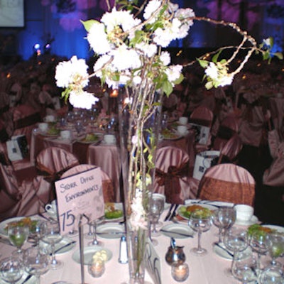 Orchid blossoms were used to hide the stems in the bottom of the cherry blossom pilsner centerpieces.
