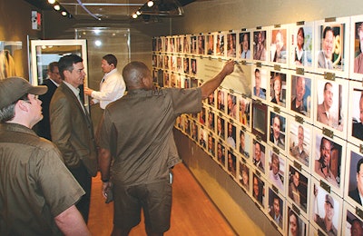 A touch-screen wall highlights notable achievements and contributions made by UPS employees from around the world.