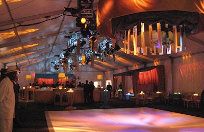XA hung 80 panels of gold mirrored acrylic from a large chandelier over the dance floor and a truss system.