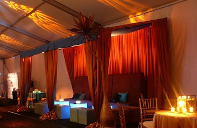 Cabanas housed high-backed loveseats in brown Ultrasuede and illuminated cocktail tables with mirrored tops.