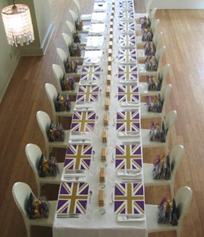 White Louis Ghost dining chairs surrounded the banquet tables, which were covered in fitted white table linens.