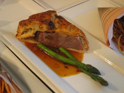 Beef Wellington was served with wild mushroom jus and steamed asparagus.