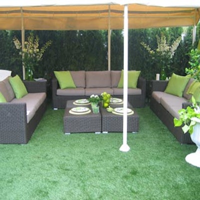 Brown outdoor lounge furniture from Party Central Events was matched with green astro turf and pear-coloured accent pillows.