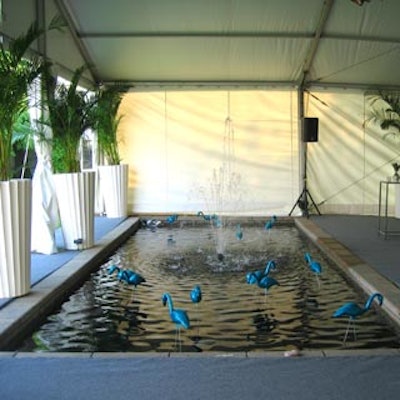 Turquoise coloured flamingos decorated the pond that flanked the silent auction tent.