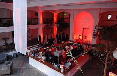 Red lighting accented alcoves and corners at Soapnet's 'Night Before' party.