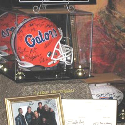 This set featuring an autographed nationalchampionship football and helmet from the University of Florida Gators receivedthe highest bid of the night.