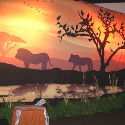 Hand-painted canvas African sunset murals were used bySpellbound Inc. as backdrops in the ballroom.