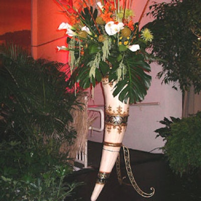 Enormous elephant tusks filled with lilies, reeds, andexotic leaves adorned each end of the stage.