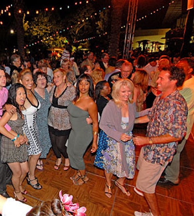 Casually dressed guests shimmied on the dance floor.