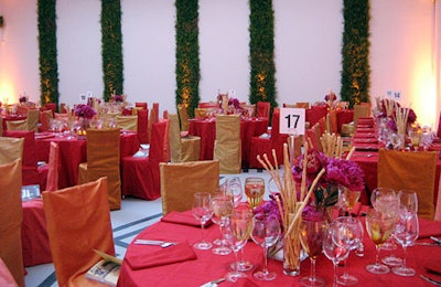 The red room of the Zwirner Gallery featured orange and red silk,arrangements of peonies and calla lilies, and greenery on the walls.