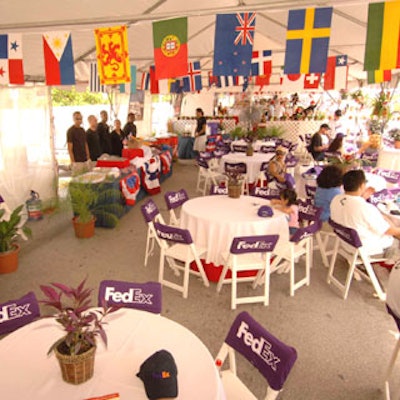 Tented areas featured Diamonette patiofurniture, Joy Wallace catering, and decor (such as these countries’ flags)provided by the MDM Group.