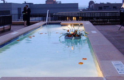 Exquisite Design Studio created floating bouquets in the pool.