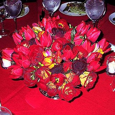 Marian Kelly provided the beautiful centerpieces with red tulips, red freesia and fashion and black magic roses.