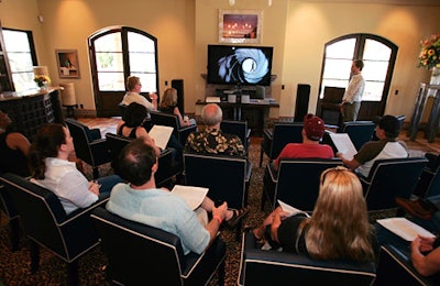 A flat-screen TV played a video loop about the Land Rover lifestyle.